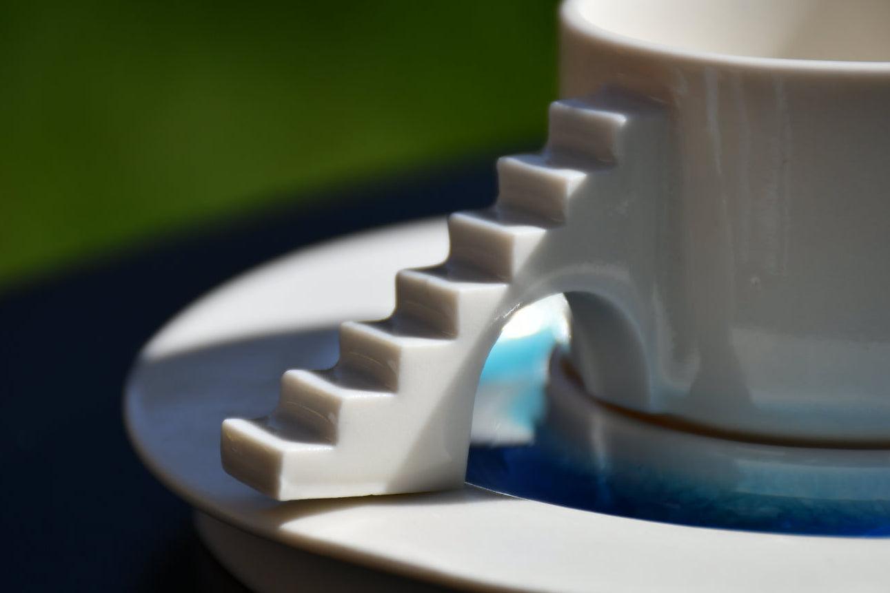 Porcelain cup with sculptural stair detail from the Castle Coffee Set