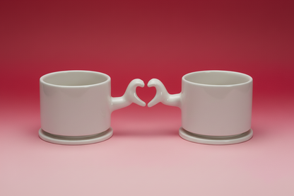 Handmade ceramic mug with heart hand gesture handle