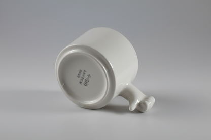 Handmade ceramic mug with thumb down hand gesture handle