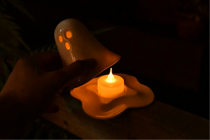Handmade ceramic ghost tealight holder with a standard tealight candle