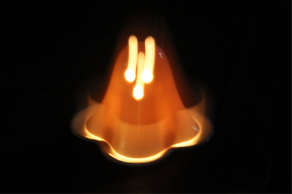 Ceramic ghost tealight holder showing the candle opening from above