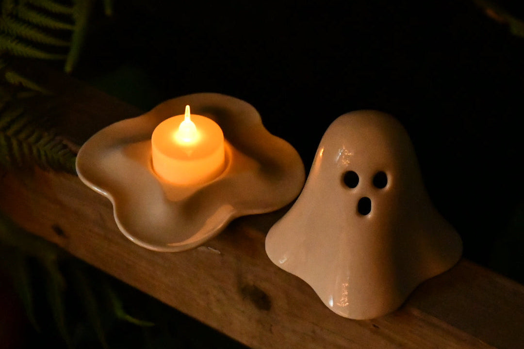 Handmade ceramic ghost tealight holder with a standard tealight candle